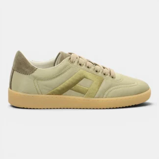 Beige sneaker with tan suede heel, beige laces, and a light gum sole showing side stitching detail. Used as a casual shoe image.
